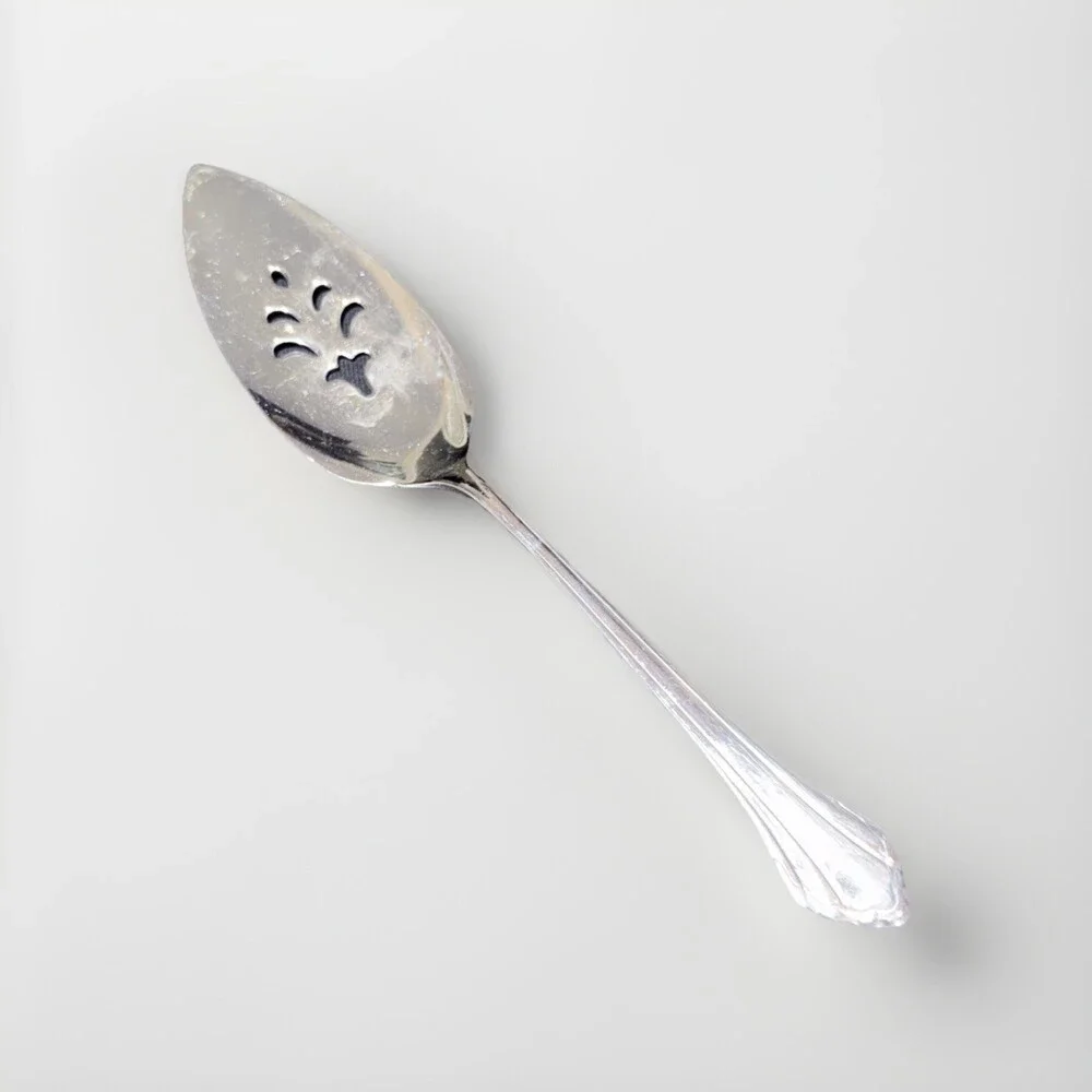 Oneida Community Royal Flute pierced pie server in stainless steel. 9.5”